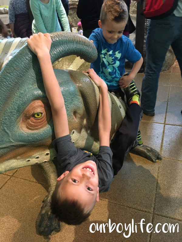 Our Boy Life - Climbing on a dinosaur